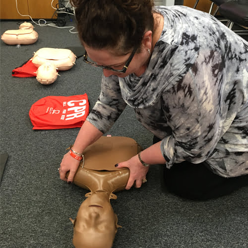 Operations Manager at Midshire Debbie Wilson performing CPR 